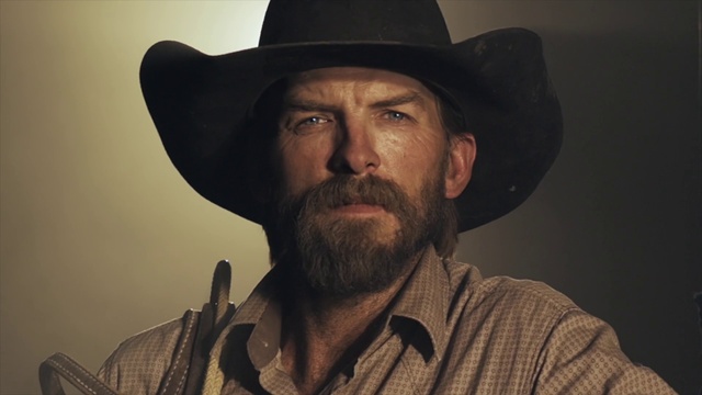 Video Reference: Chin, Hat, Beard, Organ, Fedora, Black, Guitar accessory, Facial hair, Sun hat, Collar