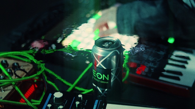 Video Reference: Green, Beverage can, Drink, Aluminum can, Technology, Toy, Tin can, Event, Font, Personal protective equipment