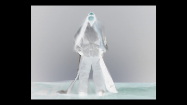 Video Reference: Sleeve, Flash photography, Gesture, Art, Fashion design, Rectangle, Formal wear, Font, Display device, Action figure