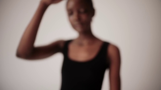 Video Reference: Hair, Arm, Active tank, Human body, Undershirt, Flash photography, Neck, Sleeve, Gesture, Waist