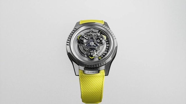 Video Reference: wristwatch, watch, luxury watch, timepiece, mechanical, analog, yellow strap, metal case, close-up, studio shot, product photo, fashion accessory, modern design, dial, isolated, minimal background