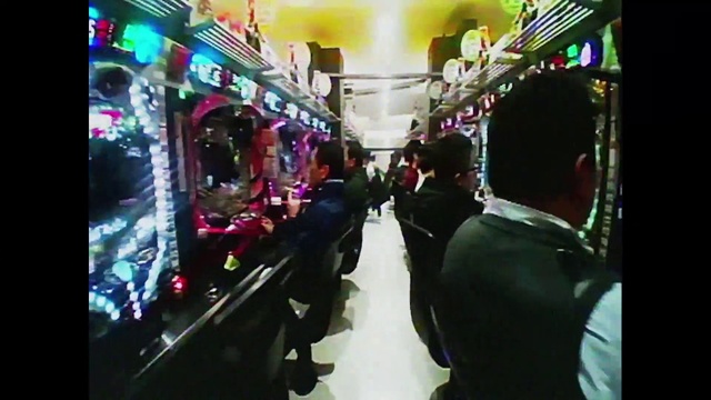 Video Reference: Fun, Entertainment, Magenta, Crowd, Event, Passenger, Electronic device, City, Market, Machine