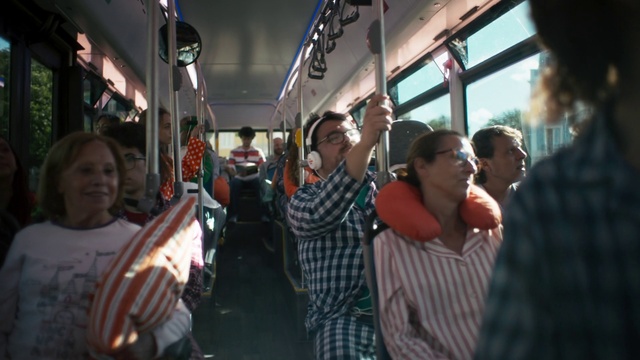 Video Reference: Social group, Vehicle, Fun, Crowd, Public transport, Event, T-shirt, Passenger, Hat, Travel