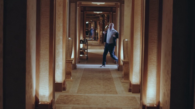 Video Reference: Wood, Building, Flooring, Human leg, City, Road, Column, Symmetry, Hardwood, Sidewalk