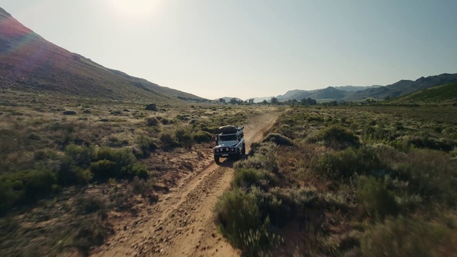 Video Reference: Tire, Plant, Sky, Vehicle, Mountain, Automotive tire, Car, Terrain, Wheel, Plain