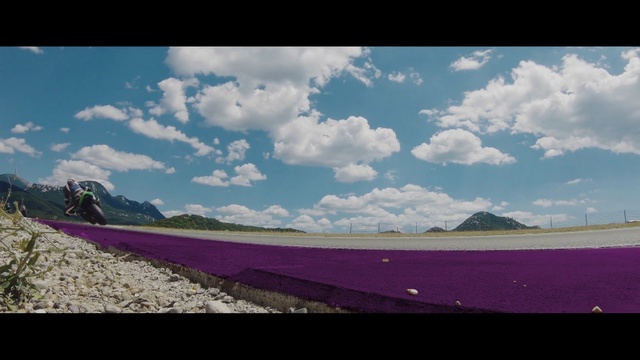 Video Reference: Cloud, Sky, Water resources, Purple, Plant, Rectangle, Natural landscape, Slope, Asphalt, Violet