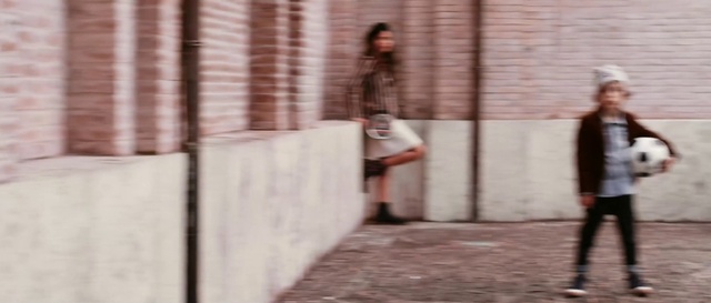 Video Reference: Wood, Street fashion, Brick, Tints and shades, Human leg, Flooring, Brickwork, Road, Sitting, Concrete
