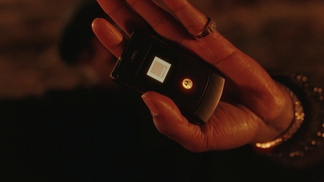 Video Reference: Hand, Finger, Gesture, Thumb, Communication Device, Nail, Wrist, Gadget, Flash photography, Font