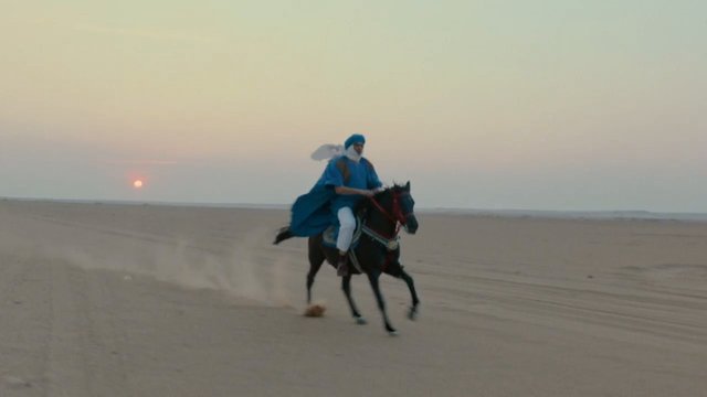 Video Reference: desert, horse, rider, sunset, landscape, sand, motion, travel, outdoors, equestrian, traditional clothing, dunes