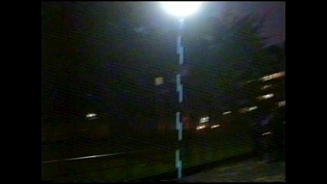 Video Reference: Building, Street light, Fixture, Rectangle, Electricity, Darkness, Security lighting, Midnight, Event, Lens flare