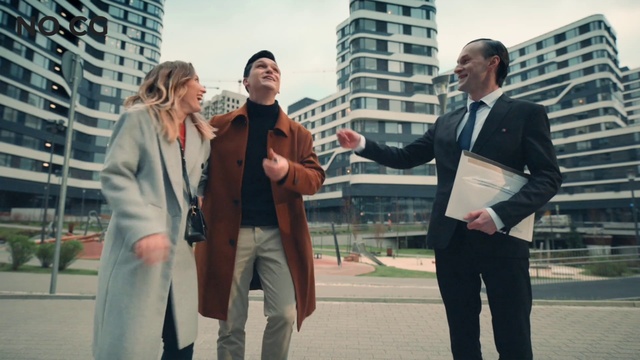 Video Reference: Sky, Building, Human, Fashion, Street fashion, Standing, Gesture, Interaction, Tie, Suit