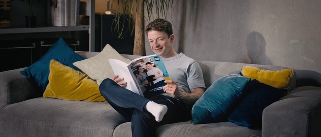 Video Reference: Smile, Couch, Furniture, Comfort, Living room, Houseplant, Gadget, Leisure, Curtain, Lap