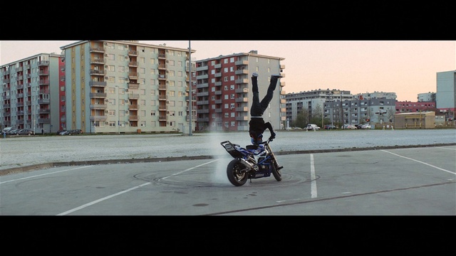 Video Reference: Wheel, Tire, Building, Vehicle, Automotive tire, Motorcycle, Motor vehicle, Automotive design, Asphalt, Road surface