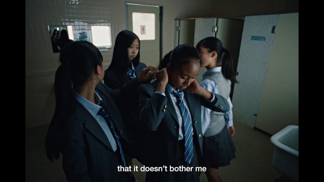 Video Reference: School uniform, Coat, Gesture, Tie, Event, Suit, Service, White-collar worker, Uniform, Formal wear