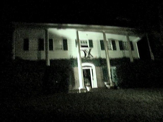 Video Reference: house, home, night, dark, exterior, porch, columns, residential, building, front entrance, low light, blurry, architecture