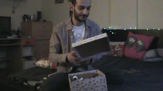 Video Reference: T-shirt, Beard, Event, Electronic device, Artist, Carmine, Fun, Sitting, Gadget, Audio equipment