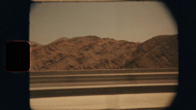 Video Reference: Rectangle, Automotive mirror, Wood, Horizon, Landscape, Tints and shades, Font, Glass, Mountain, Rear-view mirror