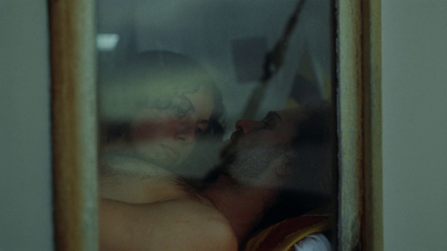 Video Reference: Window, Art, Eyelash, Glass, Chest, Visual arts, Painting, Barechested, Reflection, Transparent material
