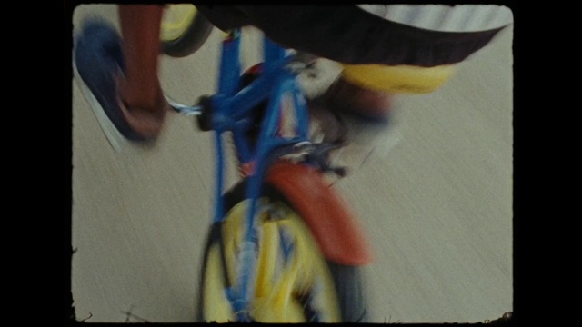 Video Reference: Bicycle, Bicycle handlebar, Elbow, Art, Knee, Electric blue, Human leg, Recreation, Wrist, Visual arts