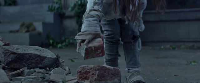 Video Reference: Grey, Automotive tire, Wood, Grass, Bedrock, Art, Sculpture, Human leg, Recreation, Road surface