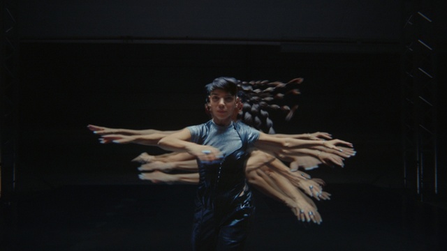 Video Reference: Flash photography, One-piece garment, Gesture, Choreography, Artist, Performing arts, Entertainment, Fashion design, Event, Art