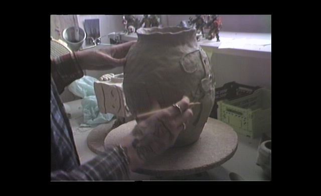 Video Reference: Jaw, Organism, Gesture, Art, Artifact, Drinkware, Font, Flash photography, Darkness, Pottery