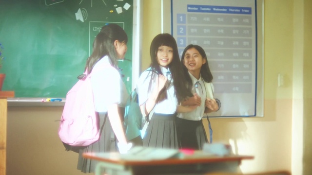 Video Reference: School uniform, Table, Adaptation, Teacher, Technology, Event, Smile, Class, Academic institution, Job