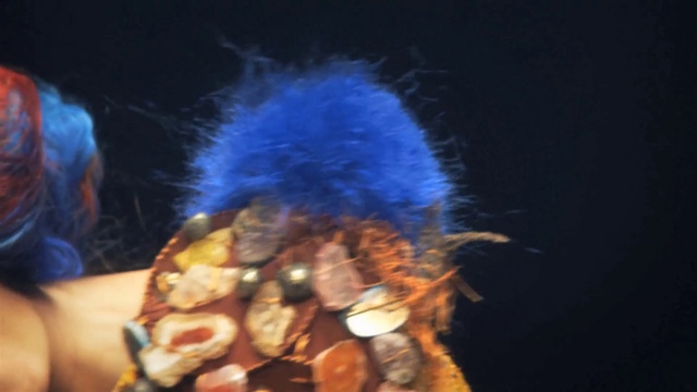 Video Reference: Musician, Entertainment, Electric blue, Event, Performing arts, Music, Facial hair, Fashion accessory, Hat, Smoke