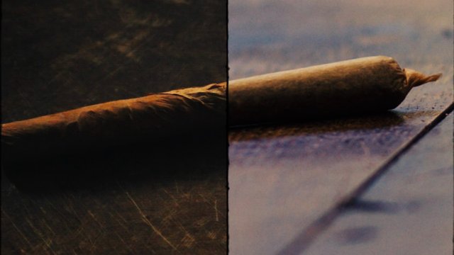 Video Reference: cigar, joint, rolled paper, close-up, macro, smoke, tobacco, cannabis, still life, dark lighting, shallow focus, texture, split screen, wood surface
