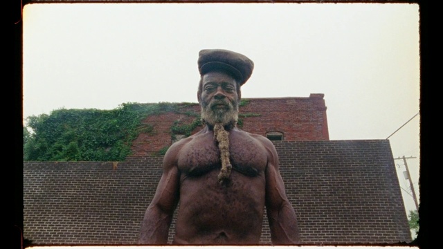 Video Reference: Head, Hand, Sky, Hat, Beard, Brickwork, Facial hair, Art, Brick, Moustache