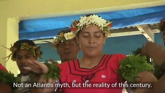 Video Reference: dance, traditional, performers, floral headpieces, indoor, cultural, group, festival, subtitles, people, performance, ritual, costume