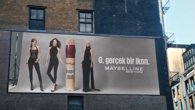 Video Reference: billboard, advertisement, cosmetics, makeup, concealer, models, city, building, brick wall, outdoor, street scene, Maybelline, urban, poster, fashion, Turkish text