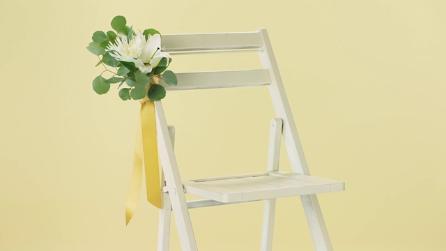 Video Reference: Flower, Plant, Chair, Petal, Twig, Natural material, Rectangle, Outdoor furniture, Artificial flower, Vase