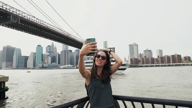 Video Reference: Water, Sky, Skyscraper, Smile, Daytime, Building, Infrastructure, Travel, Gesture, Happy