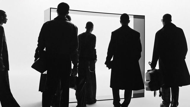 Video Reference: Frock coat, Standing, Coat, Black-and-white, Gesture, Style, Overcoat, Duster, White-collar worker, Font