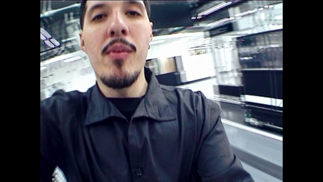 Video Reference: Forehead, Eyebrow, Beard, Jaw, Sleeve, Gesture, Dress shirt, Facial hair, Cool, Hat