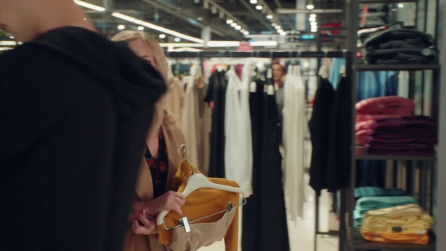 Video Reference: Outerwear, Clothes hanger, Fashion, Textile, Sleeve, Closet, Retail, Fashion design, T-shirt, Boutique