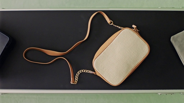 Video Reference: Wood, Font, Rectangle, Eyewear, Plant, Fashion accessory, Art, Leather, Metal, Bag