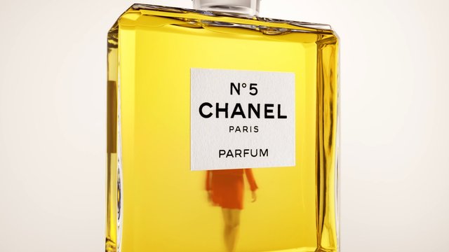 Video Reference: perfume, bottle, fragrance, yellow, glass, close-up, label, luxury, product, cosmetic, fashion, packaging, studio, chanel
