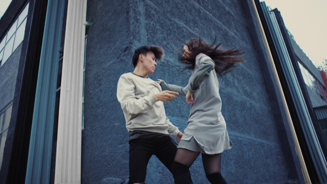 Video Reference: Leg, Shorts, Flash photography, Dress, Gesture, Street fashion, Happy, Thigh, Black hair, Fashion design