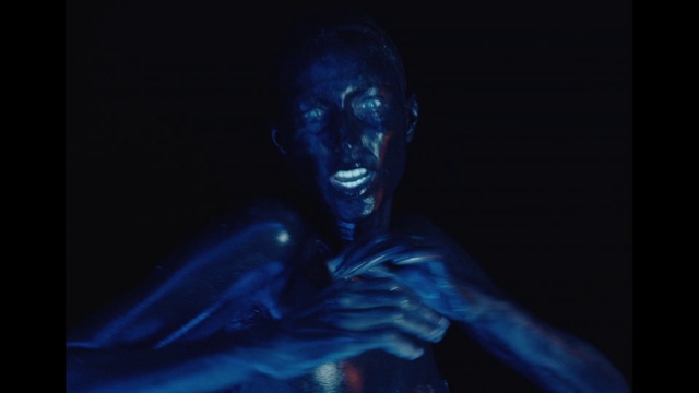 Video Reference: Flash photography, Jaw, Art, Statue, Electric blue, Fictional character, Darkness, Chest, Event, Monument