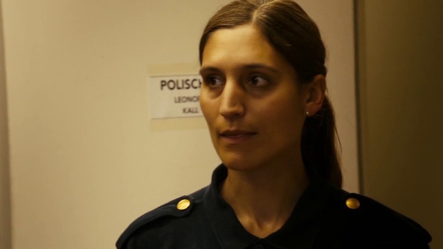 Video Reference: Hair, Head, Sleeve, Gesture, Military uniform, Military person, Event, Eyelash, Lipstick, Spokesperson