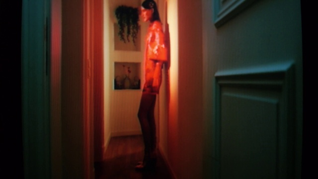 Video Reference: Orange, Thigh, Wood, Flash photography, Tints and shades, Fashion design, Human leg, Art, Magenta, Door