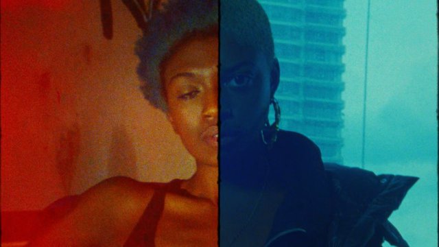 Video Reference: portrait, woman, split screen, close-up, color contrast, red light, blue light, stylized, abstract, indoor, face, shoulder, dramatic lighting