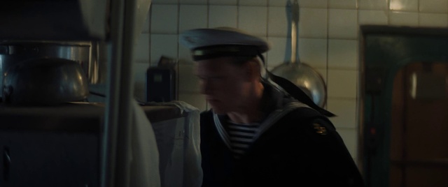 Video Reference: Cap, Hat, Darkness, Public transport, Soldier, Military person, Personal protective equipment, Air travel, Uniform, Room