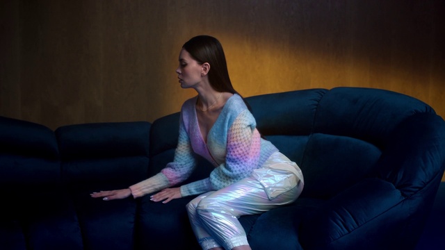 Video Reference: Hair, Couch, Furniture, Comfort, Purple, Flash photography, Knee, Black hair, Thigh, Electric blue