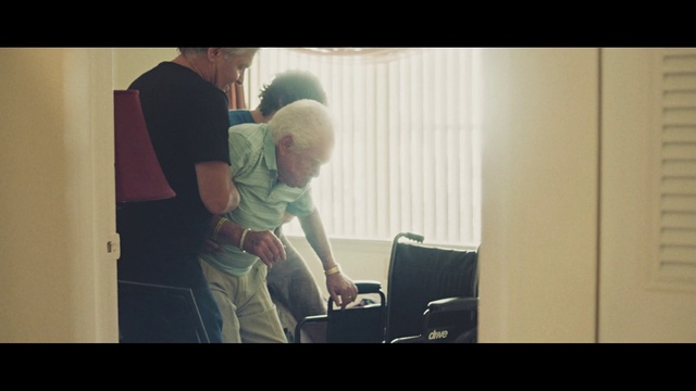 Video Reference: Flash photography, Standing, Gesture, Chair, Fun, Display device, Event, Happy, Font, Sitting