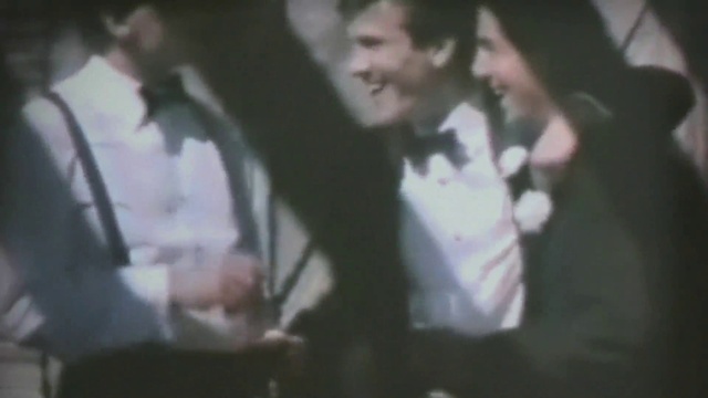 Video Reference: Smile, Human body, Gesture, Music, Entertainment, Formal wear, Event, Tie, Thumb, Performing arts