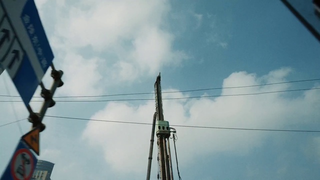 Video Reference: Cloud, Sky, Building, Electricity, Overhead power line, Tree, Cumulus, Wire, Pole, Public utility
