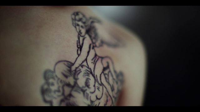 Video Reference: Leg, Human body, Sleeve, Gesture, Temporary tattoo, Chest, Elbow, Art, Tattoo, Trunk